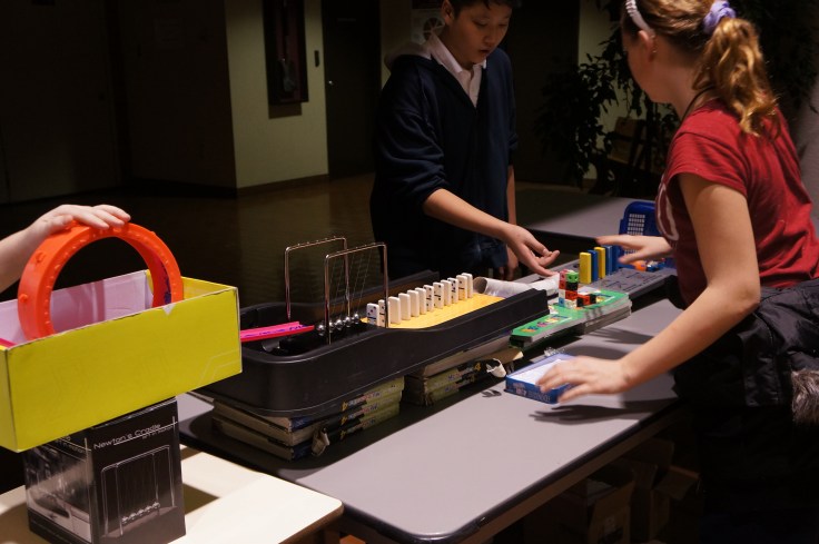 Each school's machine connects with another to make one giant Rube Goldberg Machine!!