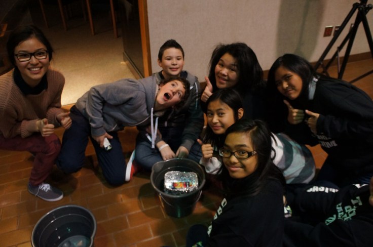 E-CSLIT Chair, Theresa Hoang checks in with St. Rose of Lima to see how their boat is doing. 