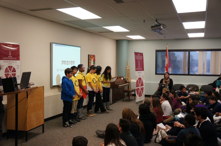 St. Kateri Tekawitha, one of Camp Olympia's host schools, lead the group in prayer.