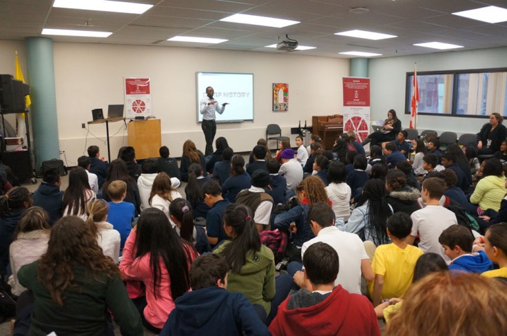 Stefan Ntansah, a student leader, giving a camp history of Camp Olympia.