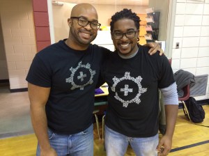 Mike hands off the mic to the two guest speakers for the day, Adam and Justin! They explained the elements of school spirit!